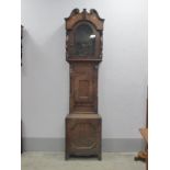 XIX Century Mahogany Clock Case, with a swan neck pediment, arched door, trunk with a small door, on