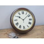 A Railway Style Clock, the mahogany circular case, with white enamel dial, with Roman numerals,