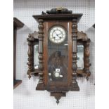 A Late XIX Century Walnut Cased Vienna Wall Clock, white enamel dial with Roman numerals, glazed