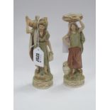 A Pair of Royal Dux Figures, both carrying baskets, 18.5cm high.