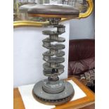 An Industrial Art Stool, made form a crankshaft and disc brake, swivel action, circular seat and