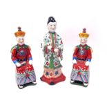 Oriental; A Pair of Chinese Pottery Figures of Seated Gentlemen, one holding a fan, 31cm high