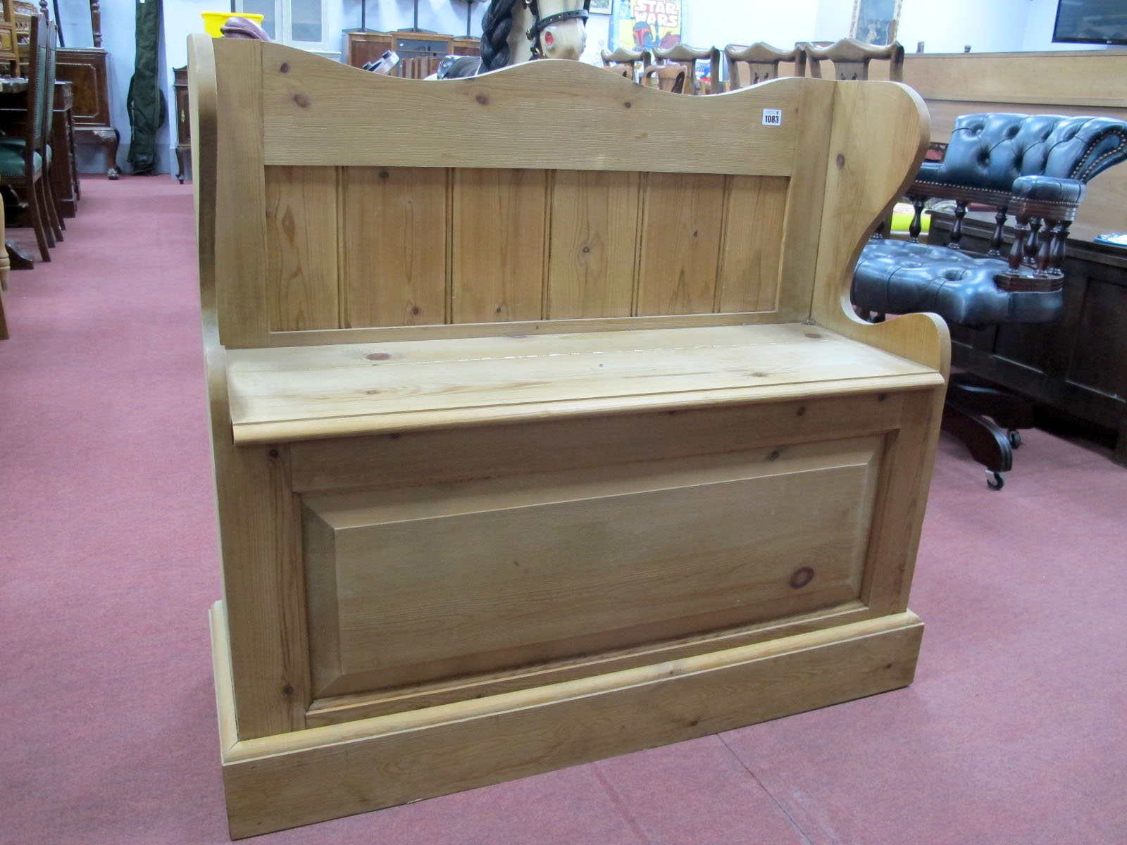 A Pine Bench, with lift-up seat revealing storage compartment, shaped sides, on plinth base, 84.