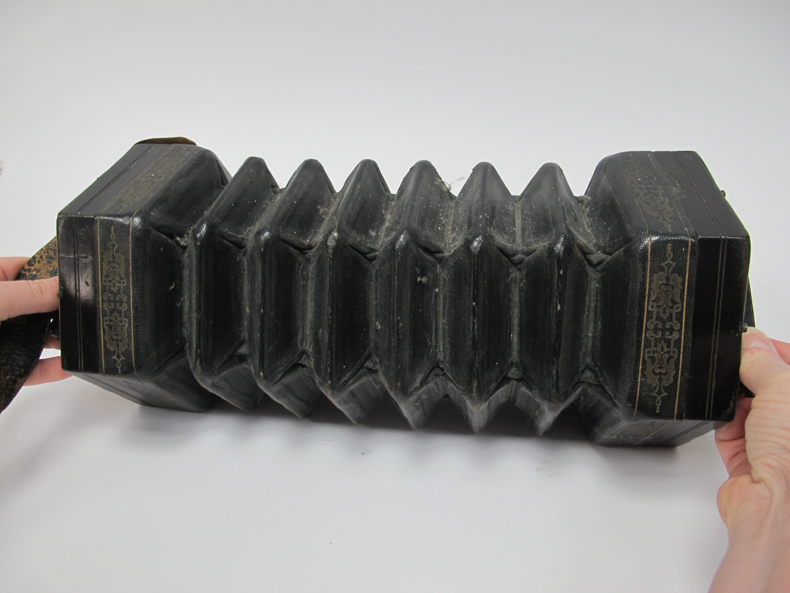C. Jefferies Concertina, with thirty buttons (one absent), six section leather bellows, fret cut - Image 5 of 6