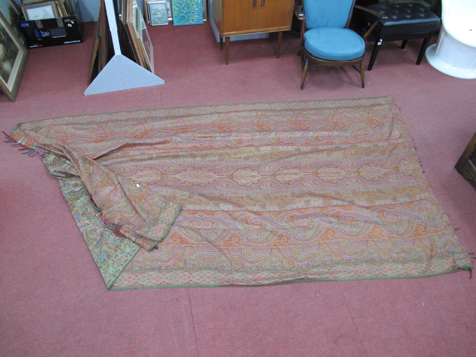 A Paisley Vintage Throw, in traditional colours, green border, tasseled ends, approximately 330cm