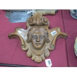 A XIX Century Carved Walnut Wall Hanging with Mask Head, within scroll and shell surround, 37cm