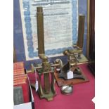 Two Brass Microscopes, circa 1900 no visible makers name, one on iron base, the other taller at