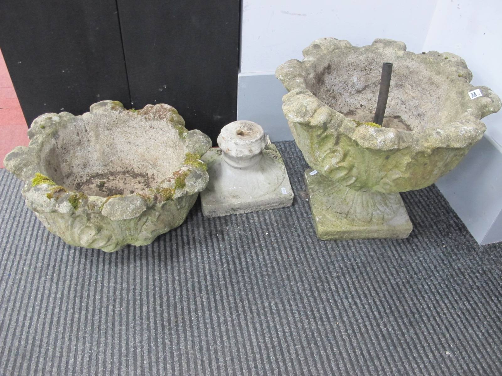 A Pair of Stoneware Planters, with a shaped rim, leaf decoration, on stands, 40cm high.