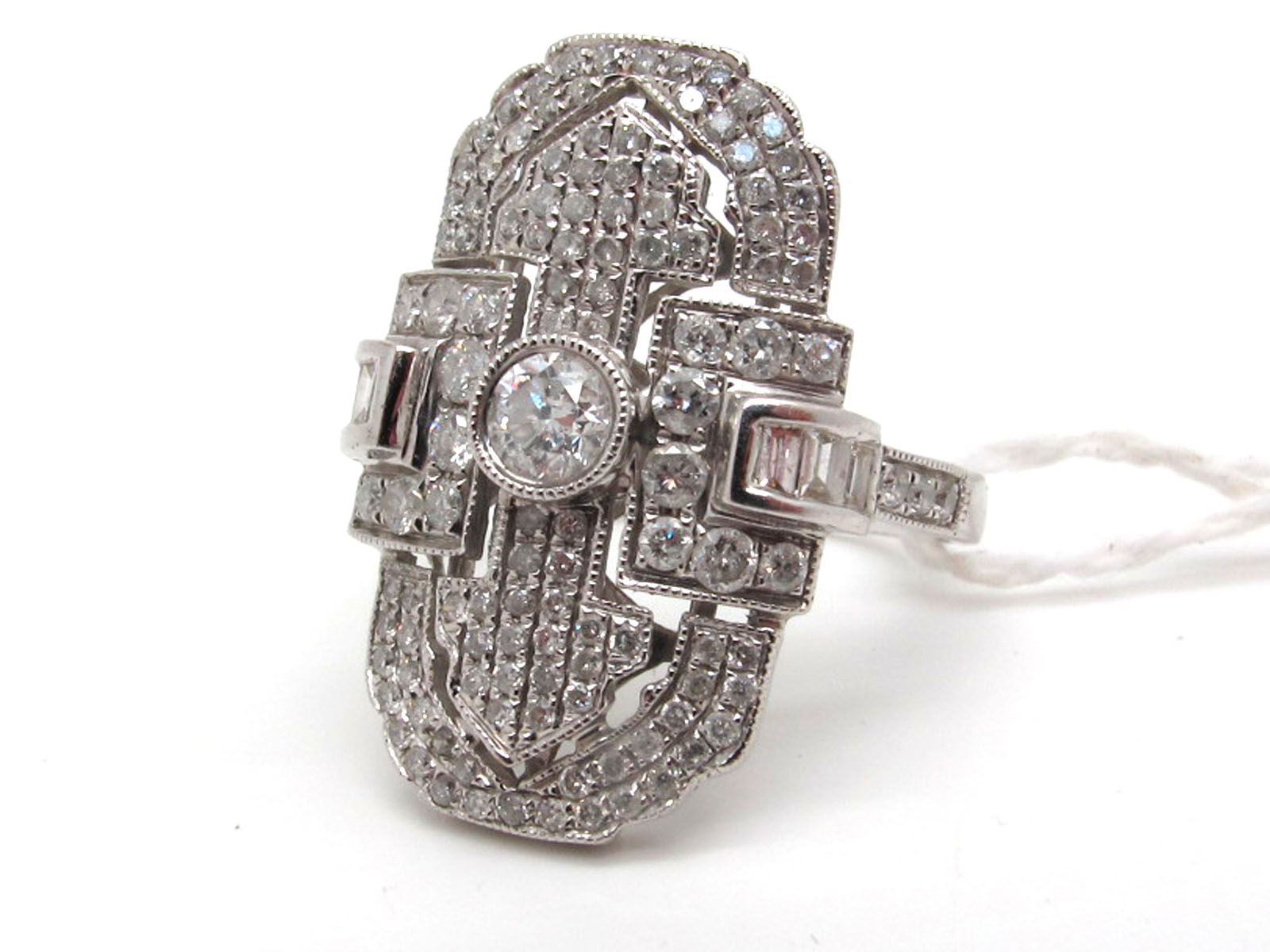 A Large Modern Art Deco Style Diamond Set Cocktail Dress Ring, the large panel set throughout with