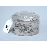 Hung Chong; A Chinese Circular Lidded Box, detailed in relief with sinuous dragons, pull off