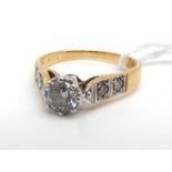 An 18ct Gold Single Stone Diamond Ring, the brilliant cut stone illusion set, high between