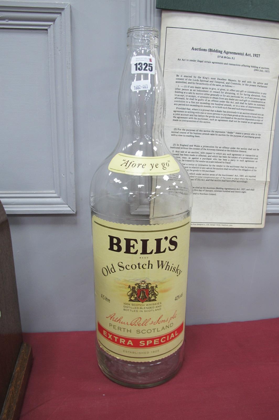 An Empty 4.5 Litre Bells Whisky Bottle.