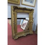 XIX Century Gilt Wood Picture Frame, with applied shell and foliate mounts, 84 x 70cm, aperture
