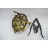 A Brass Sun Dial, together with a folding pair of clippers, stamped 1917, 31