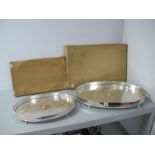 A Decorative Oval Plated Gallery Style Tray, with leaf scroll decoration, raised on four claw and