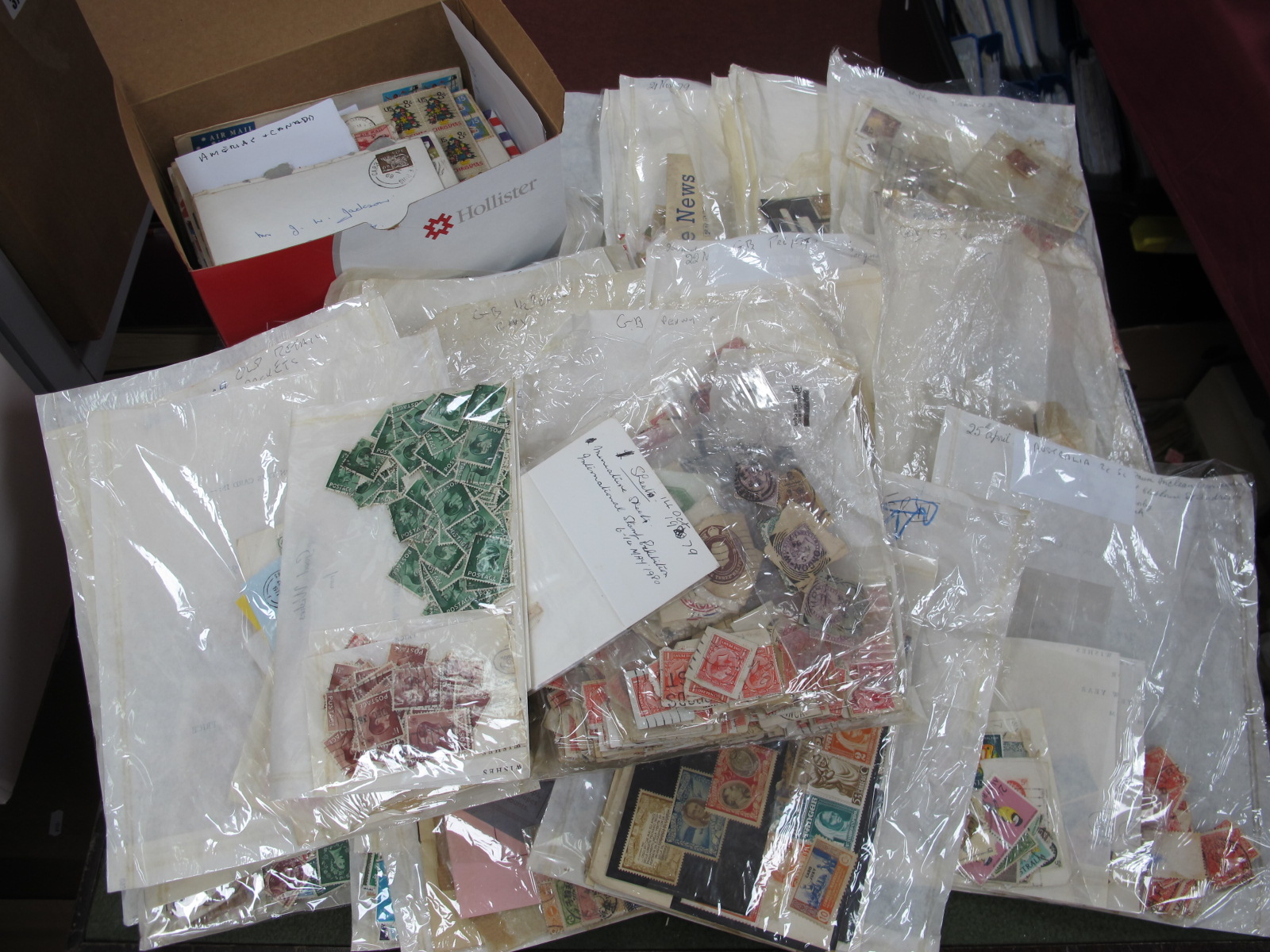 A Box of World Stamps, loose in packets, early to modern, mainly off paper, includes G.B and British