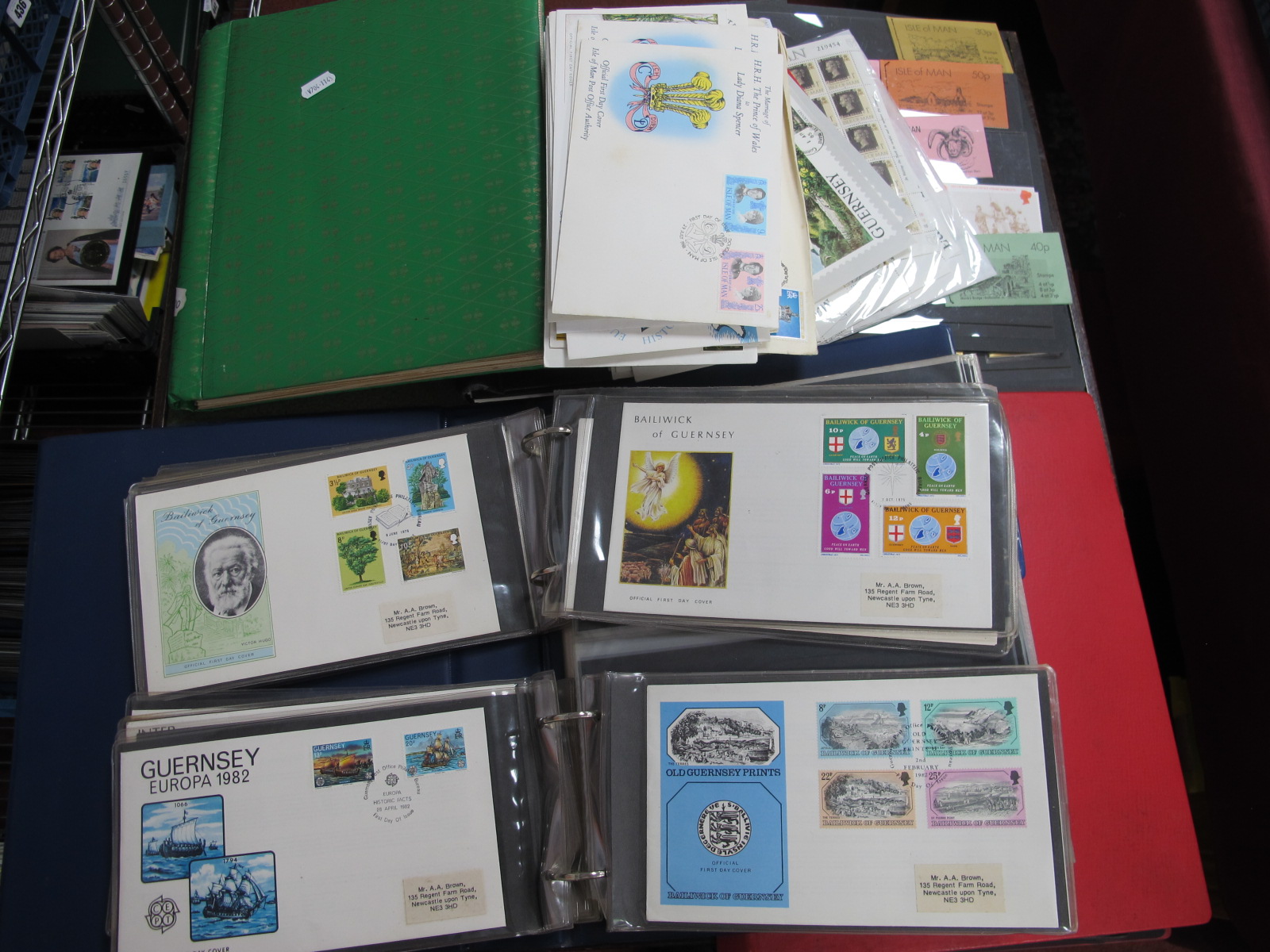 Channel Islands and Isle of Man Collection, housed in two loose leaf albums and an old photo