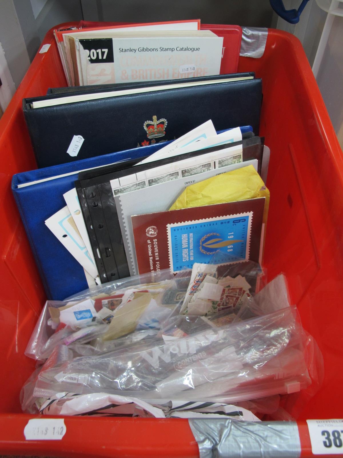 An Accumulation of World Stamps, loose on and off paper in bags, albums (4), stockbook (1). Also