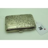 A Hallmarked Silver Cigarette Case, allover leaf scroll engraved (75grams).