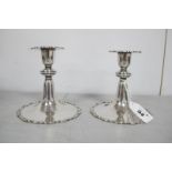 A Pair of Hallmarked Silver Candlesticks, E&Co Ltd, London 1905, each of spreading circular form