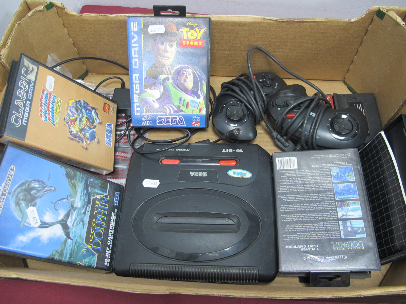 A Sega Mega Drive II 16-Bit Gaming Console, (untested - sold for parts only), two control pads,