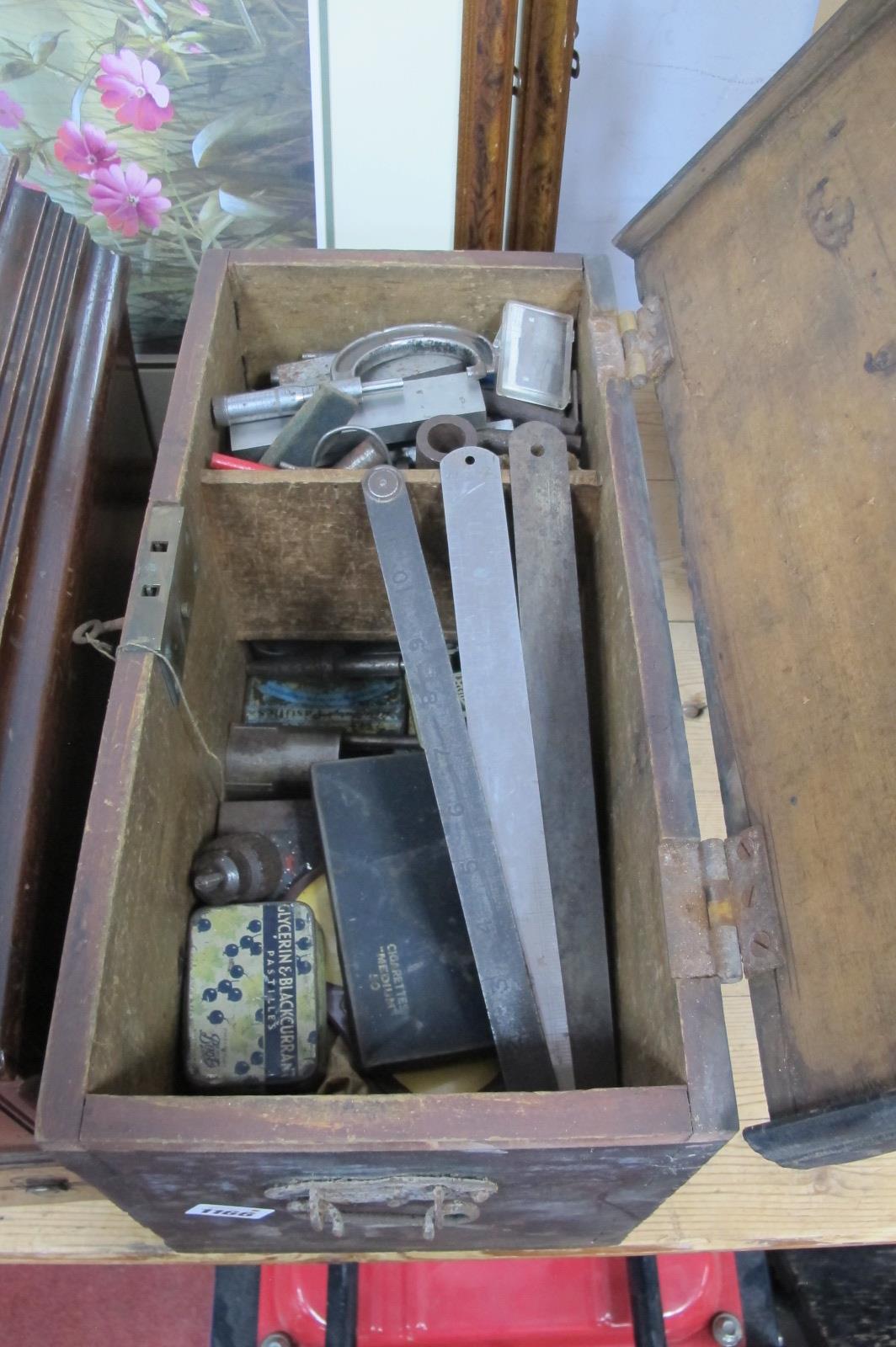 Drill Bits, steel rulers etc, in a tool box.