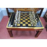 A Mahogany Brass Bound Games Table, with chess bound top, brass border on square supports, united by