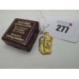 A Modern Maltese Religious Pendant, depicting face of Jesus Christ, stamped "750" (2.4 grams).