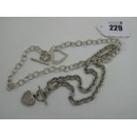 A Chain Link Necklace, suspending inset heart with t-bar toggle style fastener, stamped "925", and