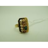 An Emerald Set Ring, rectangular collet set, within pierced panel setting, between plain