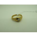 An 18ct Gold Single Stone Diamond Ring, the old cut stone rubover set within plain setting (finger