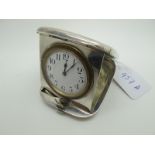 A Hallmarked Silver Cased Travel Clock, Grey & Co, Chester 1912, the rounded rectangular case with