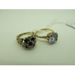 A 9ct Gold Cluster Ring, (one stone missing) between wide tapering textured shoulders (finger size