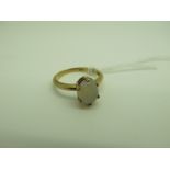 An Opal Single Stone Ring, oval cabochon claw set, stamped "9ct" (finger size N).