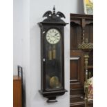 A Mahogany Vienna Wall Clock, turned finial, Roman numeral dial, full length, glass front.