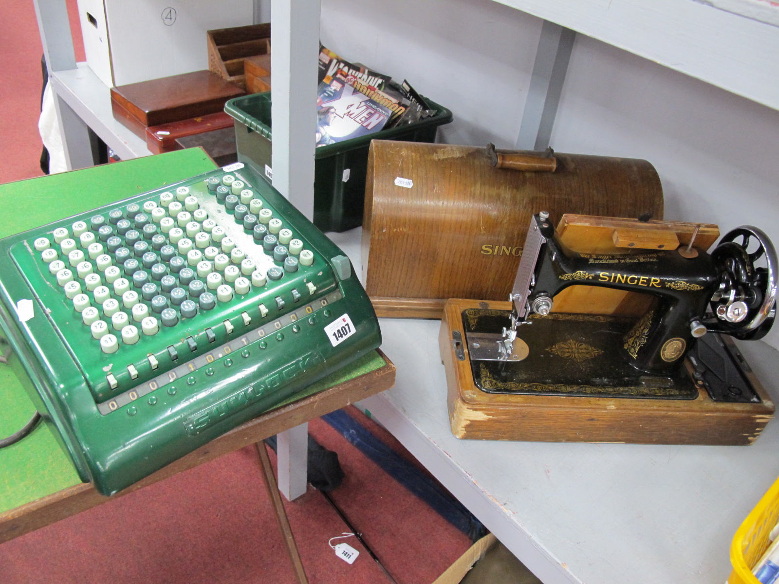 Singer Sewing Machine, cased; together with a Sumlock Comptometer. (2)