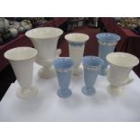 Wedgwood Queensware Tall Fluted Vases, white and blue grounds, shell handled vase, a smaller example