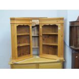 A Pair of Pine Corner Cupboards, with open shelves, together with a pine wall rack, (3)