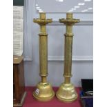 An Impressive pair of Ecclesiastical Candlesticks, stepped wax catchers, circular shafts with