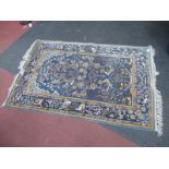 A Middle Eastern Silk Rug, with a central tree of life design with birds, amongst foliage,