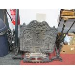 XIX Century Cast Iron Fire Back, decorated with figures, together with fire grate, fire irons.