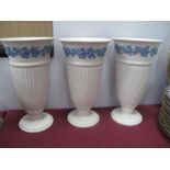 Three White Ground Wedgwood Queens Ware Fluted Tall; Vases, vines to rim, 28cm high.