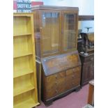 A XX Century Walnut Bureau Bookcase, top with glazed doors, bureau with a fall front, 3 long