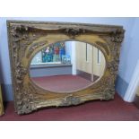 XIX Century Style Rectangular Gilt Wall Mirror, with 'C' Scroll and shell decoration, oval central