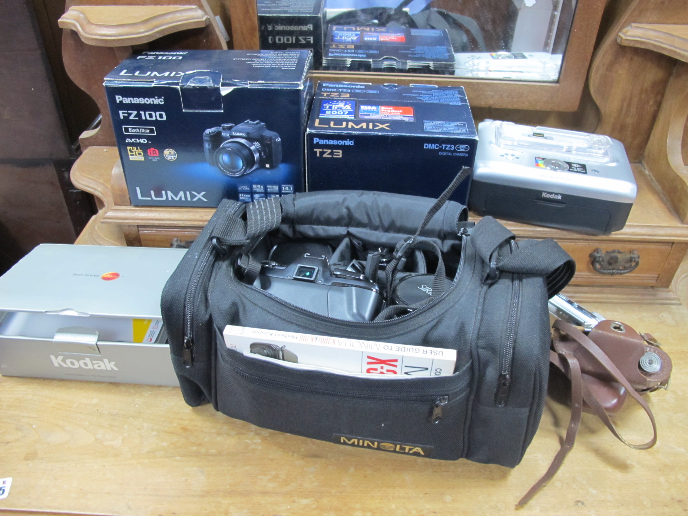 Cameras - A Kodak digital camera, Halina film camera in leather case, guides, etc:- One Box.