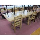 A Contemporary Beech/Pine Kitchen/Dining Table, square supports 78cm high with two extra leaves, a