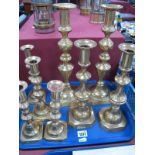 A Selection of Brass Candlesticks, of similar turned form, the largest 35cn high (8).