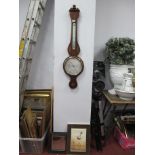 An Edwardian Banjo Barometer, heavily inlaid with shell patina and stringing (glass missing).