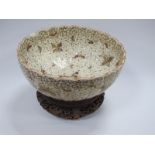 XX Century Japanese Meji Period Bowl, decorated with butterflies (chips to rim), on a hardwood