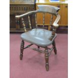 A XX Century Ash-Elm Office Chair, with a low back, pad arms, upholstered seat, on turned legs,
